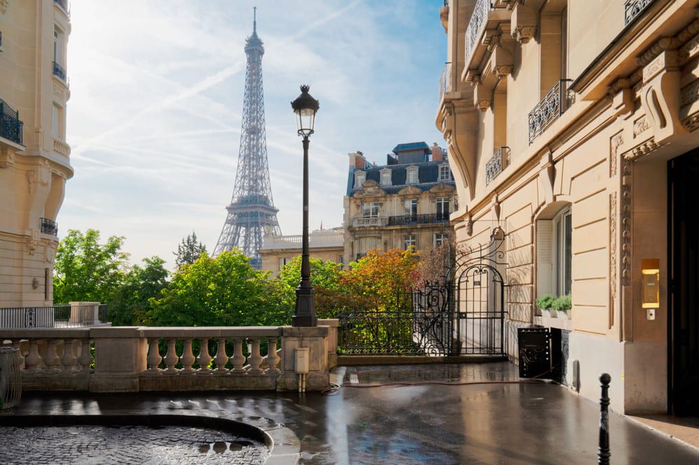 View of a Parisian alleyway with the Eiffel Tower in the background